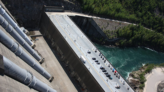 Revelstoke Dam penstocks parking View from top of Revelstoke Dam shows penstocks and parking lot for the Dam Visitor Centre.