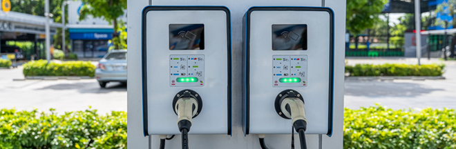 double charging stations in a parking lot double charging stations in a parking lot