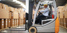 Electric forklift in warehouse