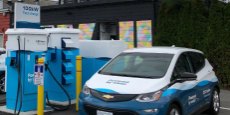 Electric vehicles plugged in at a charging station