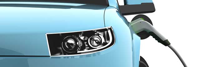 Close up image of an electric car plugged in Close up image of an electric car plugged in