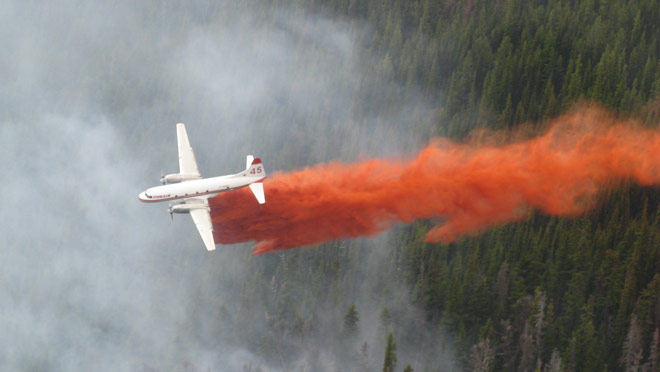 Conair water bomber drop onto forest fire Conair water bomber drop onto forest fire