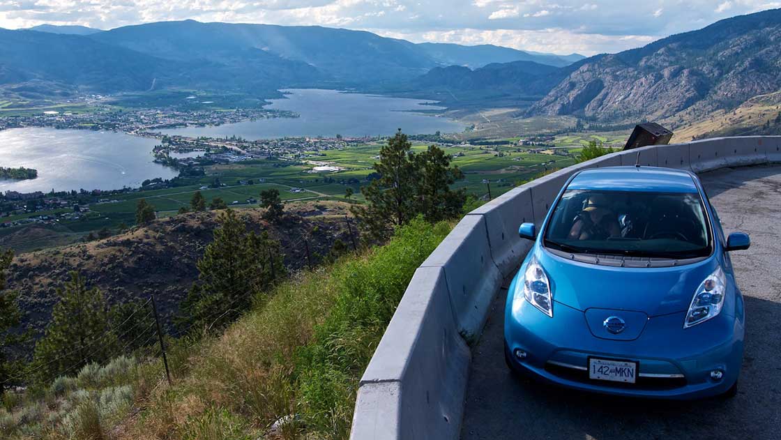 Nissan Leaf on hill near Osoyoos A Nissan Leaf electric vehicle sits parked at a viewpoint on the highway above Osoyoos, B.C.