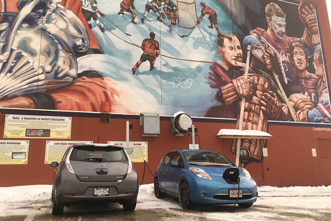 Two Nissan Leafs plugged in at Trail arena Two Nissan Leafs plugged in at Trail arena