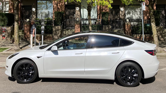 Image of a Tesla Model 3 parked on a Vancouver street