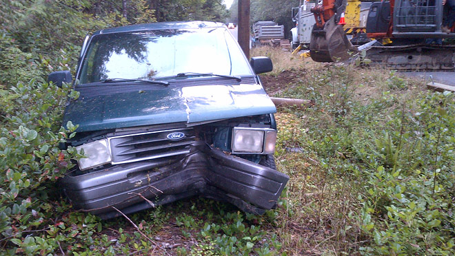 Image of a van that has hit a power pole near Ucluelet Image of a van that has hit a power pole near Ucluelet