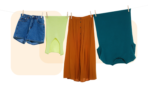 A clothes line with four items of clothing hang drying