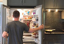 Man looking in fridge