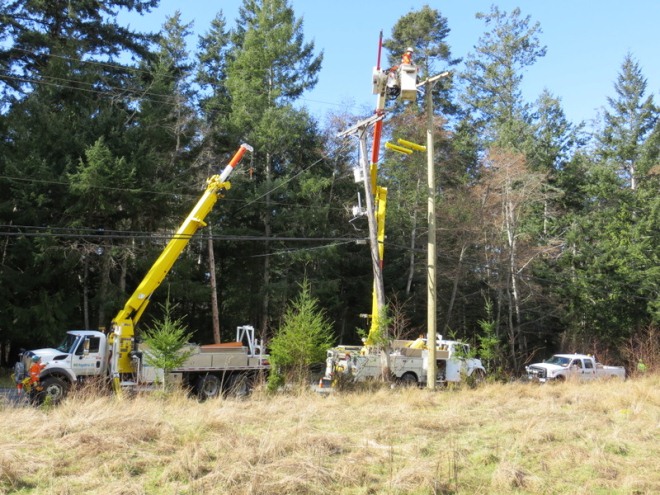 Replacing aging power poles with bucket truck					