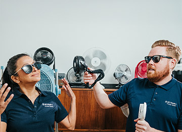 BC Hydro spokespeople Dave and Jaclyn stay cool with portable hand fans
