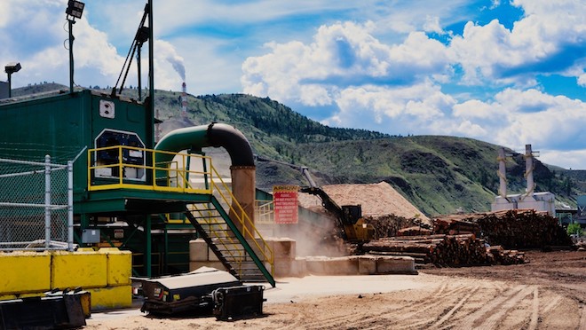 A large capacity all-electric wood chipper and an electric conveyor at Arrow Transportation System’s operations in Kamloops.