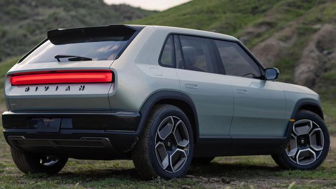 Rivian's R3 in a field background.