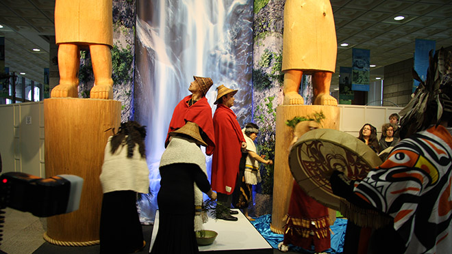 Carvers standing in front of the two statues they made during the Coast Salish unveiling ceremony in February, 2010.