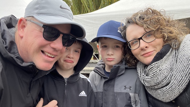 A family of four, two adults and two kids.