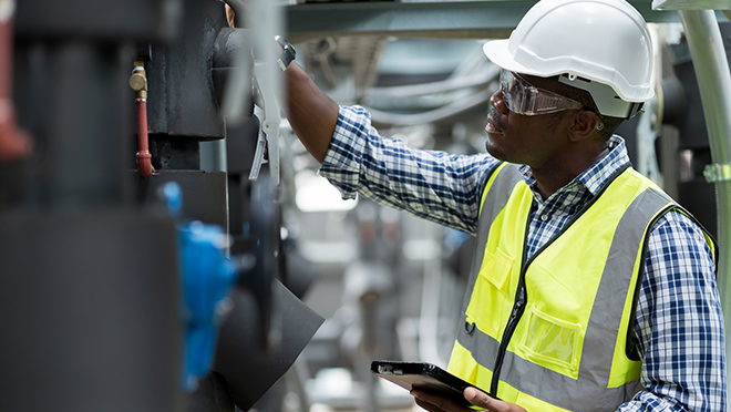 Male engineer working at construction site.