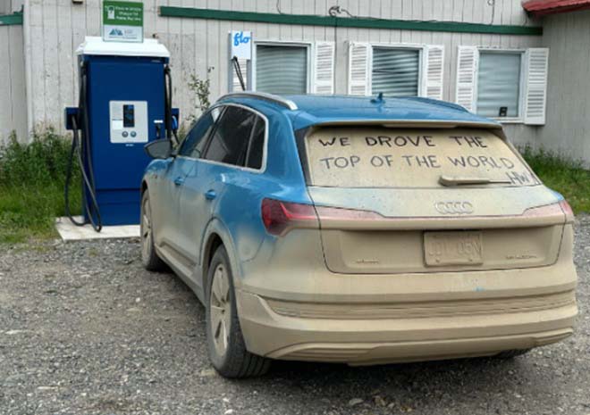 Dusty Audi e-tron parked by an EV charger