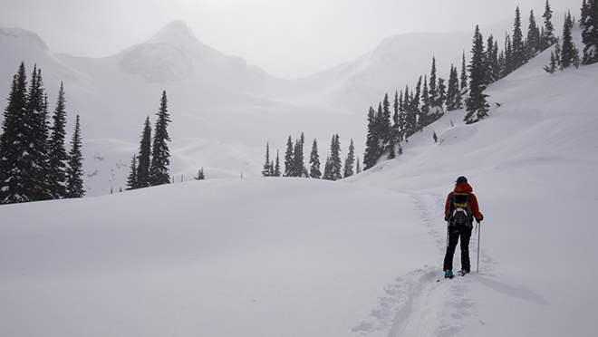 Person travels along majestic winter scene