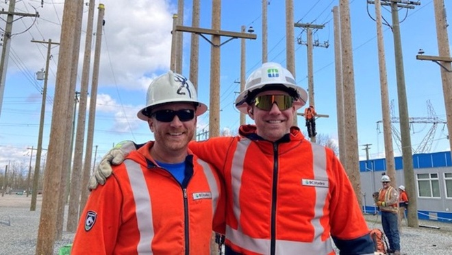 Two BC Hydro workers at an electrical training and operations yard.