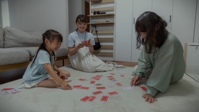 Family playing cards at home