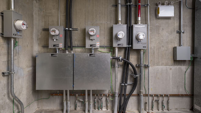 EV charging meters on a wall