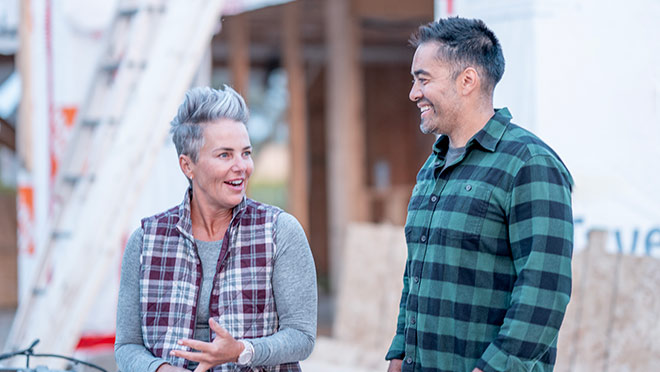 Two people at work on a project site.